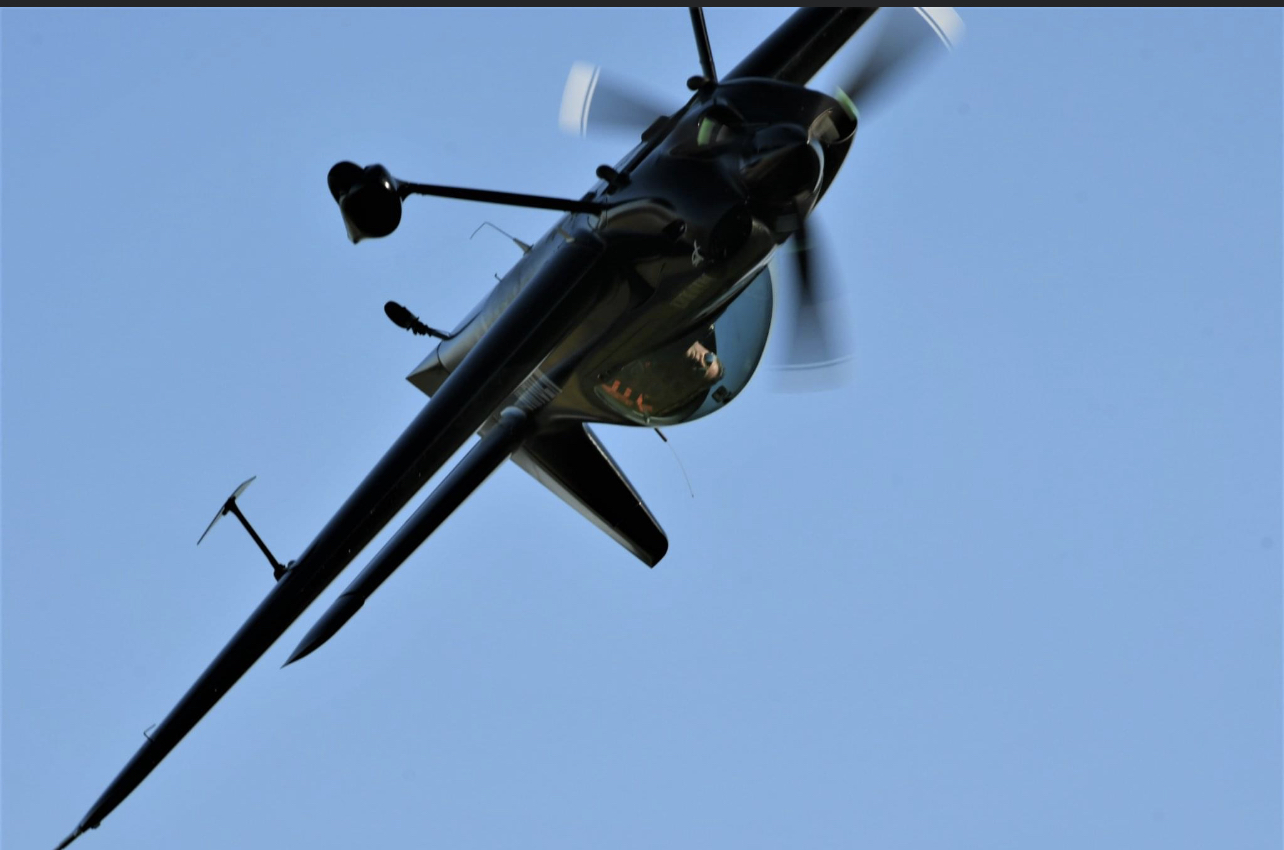 The XA-42 banking overhead during aerobatic flight
